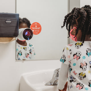 Preschool aged student Using the Time Timer WASH product to learn handwashing 