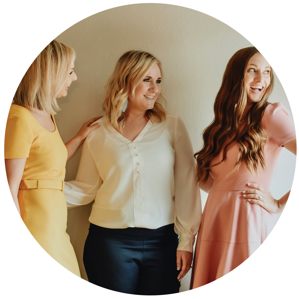 Three women smiling at photoshoot