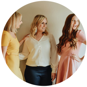 Three women smiling at photoshoot